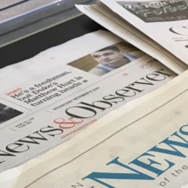 Wide shot of front page of various newspapers.